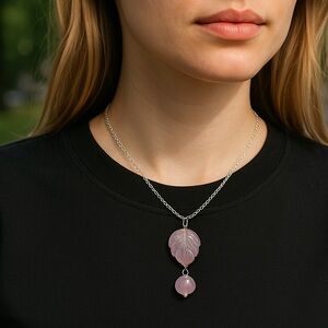 Carved amethyst pendant leaf design set in silver